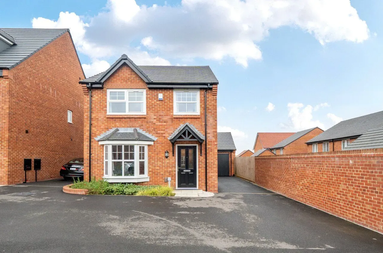 Detached brick home with bay
