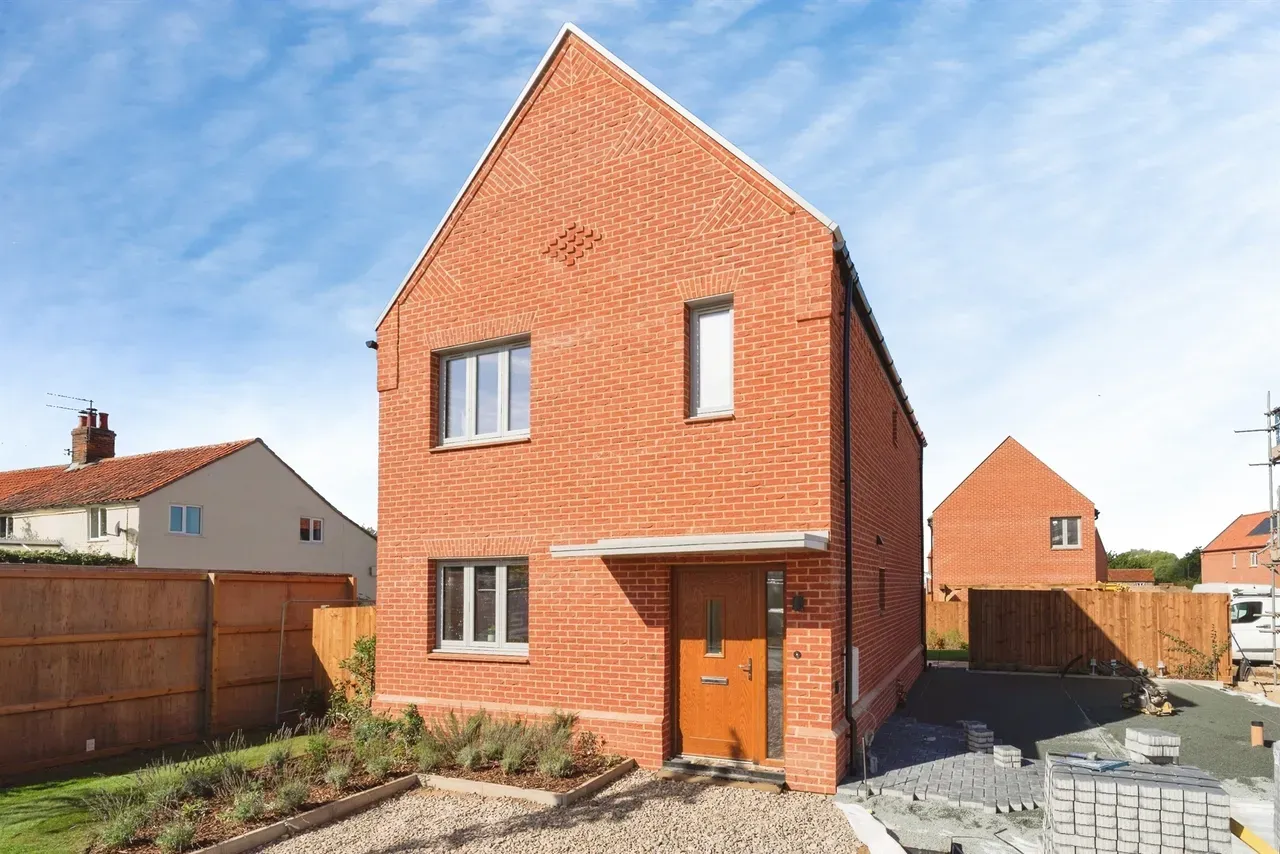 Brick house with orange door