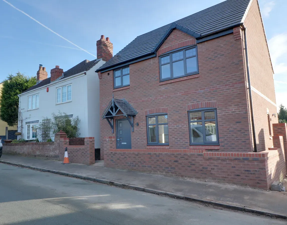 Detached red-brick house exterior