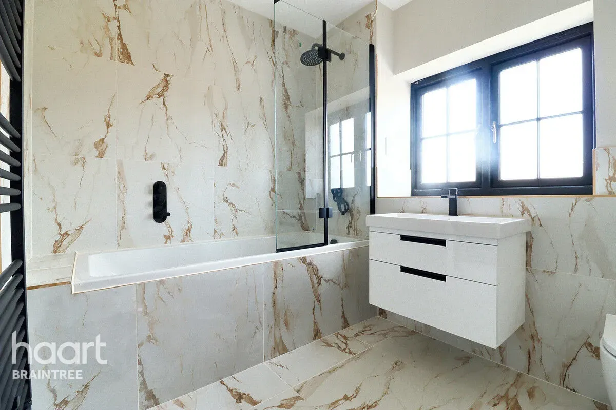 Marble bathroom with bath